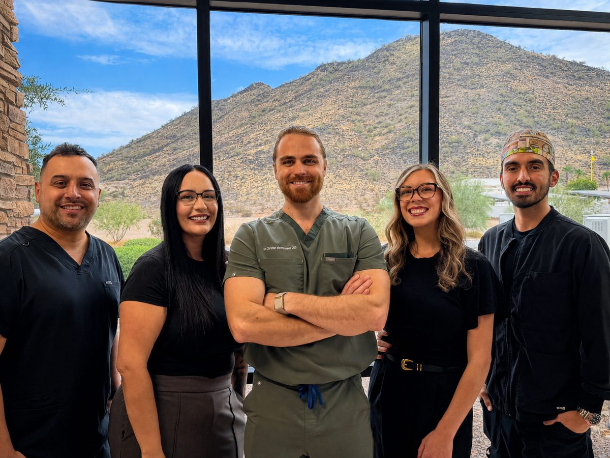 The Wellness Dental Glendale team together outside the office